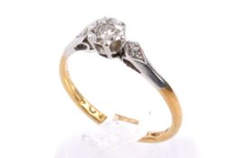 An 18ct diamond, gold and platinum ring.