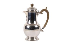 A silver coffee pot.