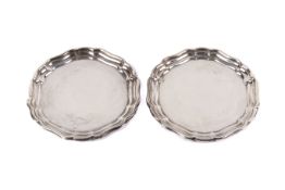 A pair of small scalloped silver dishes. Hallmarks for Joseph Gloster Ltd, Birmingham 1969.