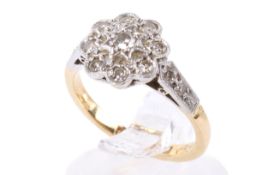 A yellow and white metal cluster ring set with single cut diamonds of 0.