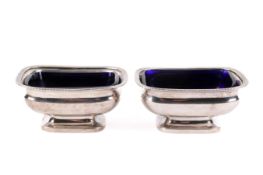 Pair of Georgian Stirling silver hallmarked table salts with blue glass liners.