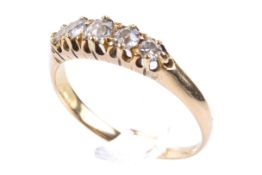 An 18ct gold and diamond ring. Set with five graduated diamonds, unmarked. Size P/Q, weight 2.8g.