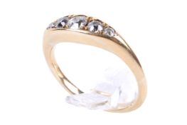 An 18ct gold and diamond ring. With five graduated diamonds, the largest circa 3.