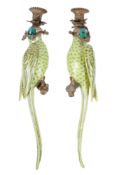 A pair of ceramic wall sconces in the form of parrots.