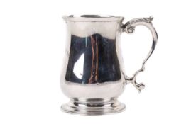A 1930s silver christening mug.