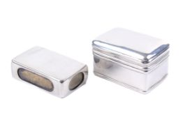 A silver ring box and a matchbox case.