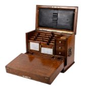 An Edwardian oak writing slope stationery box.