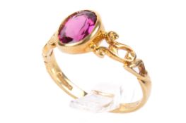 An oval faceted tourmaline gold ring. The stone circa 1.09ct, the mount hallmarked 18ct gold.
