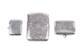 A circa 1900 silver cigarette case, a tobacco/snuff box and a vesta case.