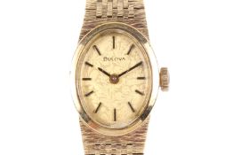 A lady's late twentieth century hallmarked 9ct gold Bulova dress watch.