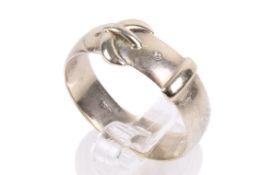 A white gold buckle ring. With a 0.6mm wide band, stamped 18ct. Size W/X, weight 6.3g.