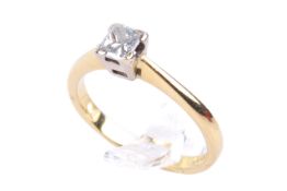 An 18ct gold single stone diamond ring. Set with one princess cut diamond of circa 0.