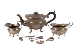 An early 20th century three-piece silver teaset and a few other items.