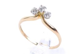 An 18ct gold three stone diamond ring. Set with three round brilliant cut diamonds of circa 0.