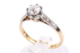 An 18ct gold single stone diamond ring. Set with one old mine cut diamond of circa 0.