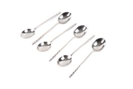 A set of six silver coffee bean spoons. With cut arrow decoration to the handles, length 9cm.