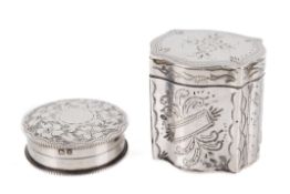 A silver trinket box and a pill box.