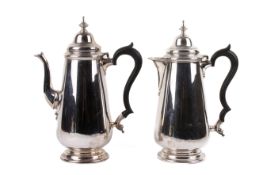Two 1930s silver coffee pots.