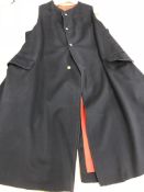 An early 20th Century navy wool policeman's cape (re-modelled and cut) together with a mid 20th
