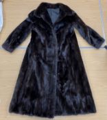 A mid 20th Century brown mink full length coat with satin lining initialled to the interior 