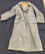 An early 20th Century gentleman's wool coat with leather lining, bears label 