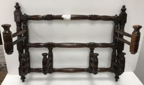 A rare 19th Century laburnum alpinum wall-mounted wig rack of six turned and ringed folding hooks,