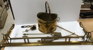 An early 20th Century brass fender,