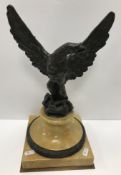 A 19th Century Grand Tour bronze spreadeagle figure on a sienna marble and bronze mounted socle