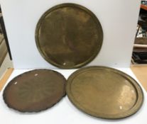 A brass charger engraved with design of King Arthur's round table, detailing all the knights,