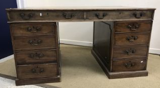 A mahogany double pedestal partners desk