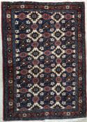 A Caucasian carpet, the central panel se