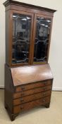An Edwardian mahogany and inlaid bureau