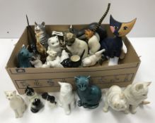 A collection of cat figures to include v