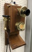 A vintage mahogany cased and brass wall