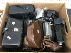 A collection of various cameras and phot