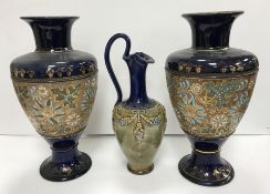 A pair of Doulton and Slaters lacework decorated blue ground vases, 33.