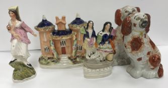 A collection of Staffordshire Pottery including two spaniel figures, 18 cm high, cottage 17 cm high,