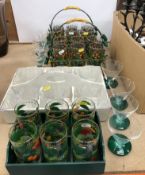 Two sets of six printed highball glasses in the Art Deco style on canework and painted wirework