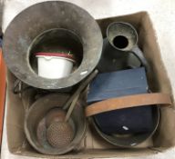A box containing assorted copper and brass wares to include haystack measure, preserve pan, etc.