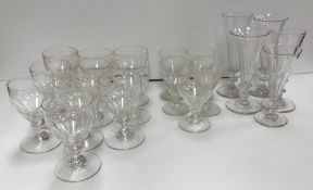 A collection of five various 19th Century facet cut trumpet bowled ale flutes on knop stems to