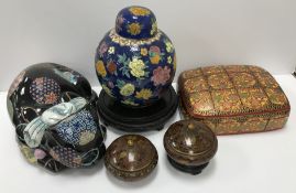 Two small Chinese Jingfa cloisonné bowls and covers, on wooden stands,