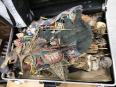 A suitcase containing various Javanese and other shadow puppets and Thai figural puppets with