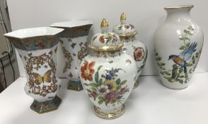 A pair of Dresden floral spray decorated egg shaped vases and covers 29 cm high,