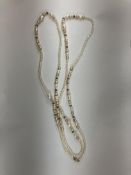 A pearl necklace with 9 carat gold clasp together with a further freshwater and cultured pearl