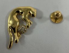 An 18-carat gold panther and ball brooch set with paste stones, 7.