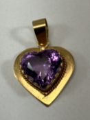 A gold mounted amethyst love heart pendant