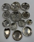 A collection of thirteen various embossed and foliate decorated ashtrays and small dishes various