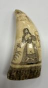 A 19th Century scrimshaw carved whale's tooth depicting a woman with sprig of flowers in her hand