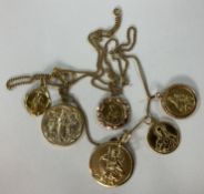 A collection of five various gold pendants / St. Christophers and a single chain, 14.