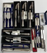 Five cased sets of carving knives and forks together with similar cake, cheese,